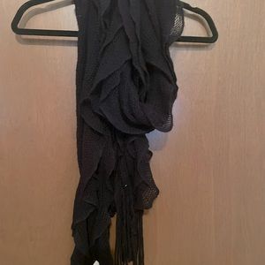 Black knitted long wavy tapered scarf.  Very warm.